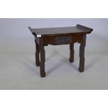 An early C20th Chinese teak low table with scroll end top and carved decoration, 62 x 36 x 49cms