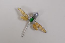A gilt and white metal dragonfly brooch set with cubic zirconia, a green pear shaped stone and a