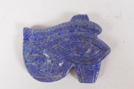 A lapiz lazuli carving of the eye of Ra, 9 x 7cms