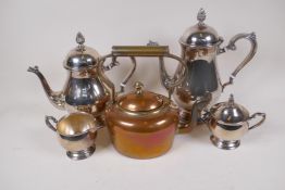 A small Victorian copper tea kettle with brass handle, 23cm high, and a four piece silver plated