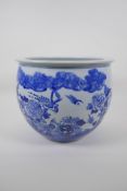 A Chinese blue and white porcelain jardiniere decorated with birds among flowers, 23cm high x 29cm