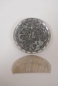 A Chinese white metal trinket dish with raised dragon phoenix and auspicious character decoration,