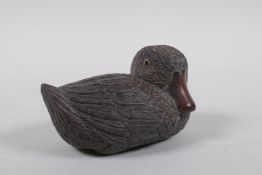 A Japanese carved wood okimono duckling, signed in a cartouche to base, 15cm high