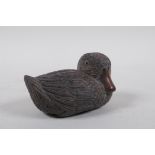 A Japanese carved wood okimono duckling, signed in a cartouche to base, 15cm high