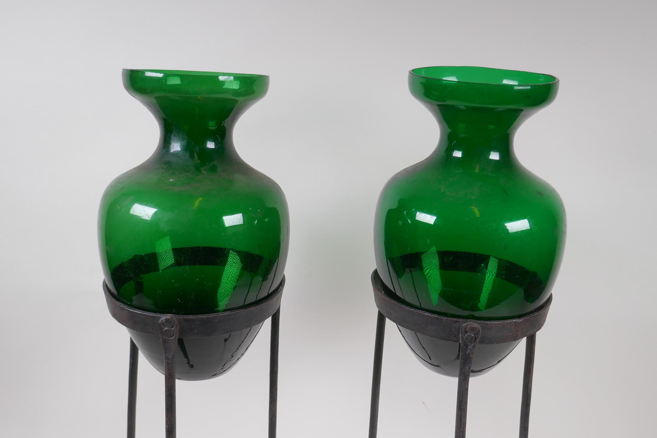 A pair of green glass vases on wrought iron stands, 56cm high - Image 4 of 4