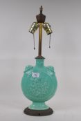 A green glaze porcelain table lamp in the form of an oriental flask, 58cm high