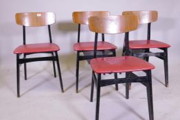 Four G-Plan dining chairs with teak veneered back rests and ebonised bases