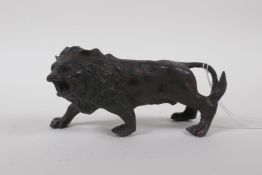 A filled bronze of a lion, 14cm long