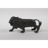 A filled bronze of a lion, 14cm long