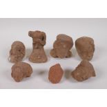 A quantity of ancient Indian terracotta head busts, largest 10cm