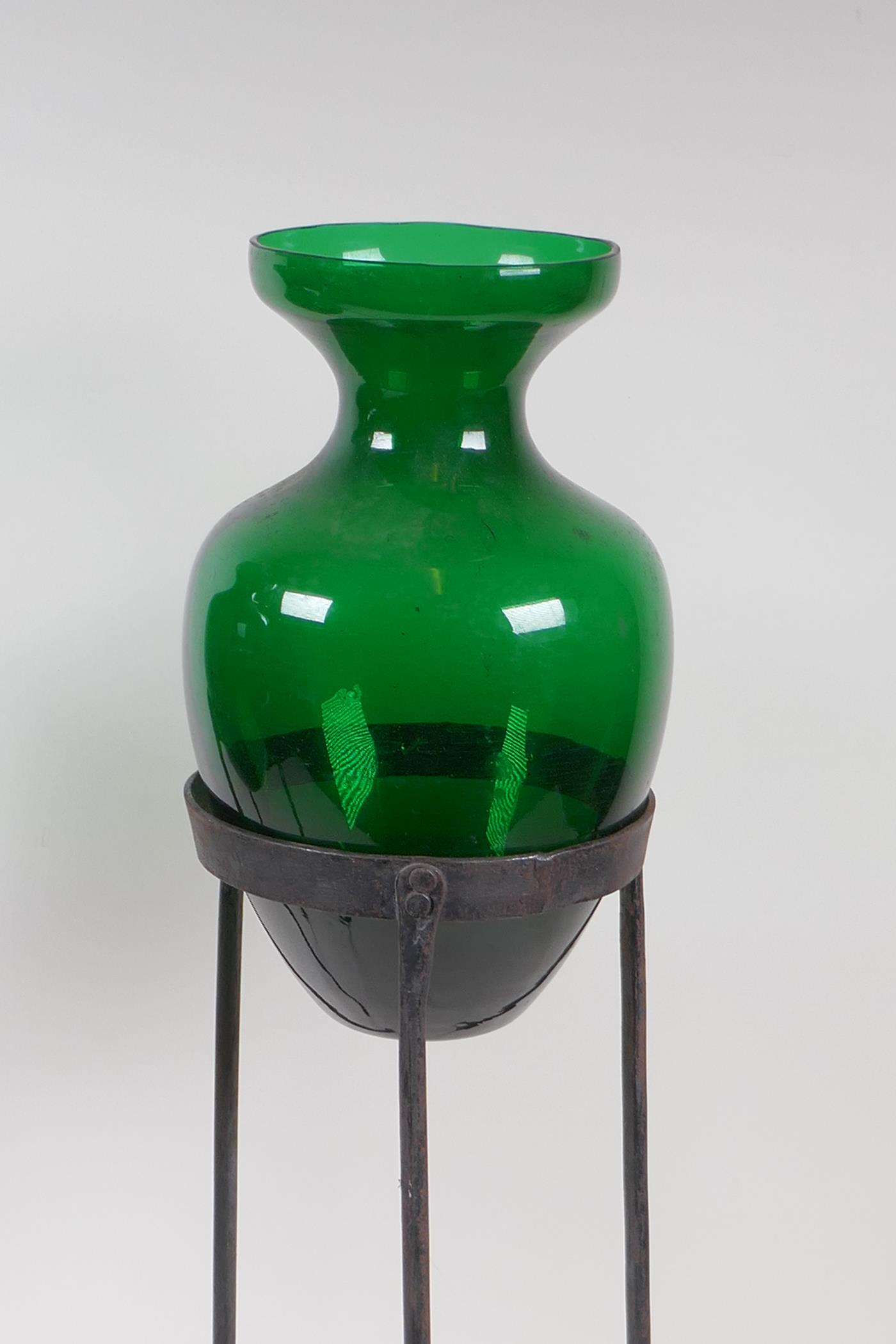 A pair of green glass vases on wrought iron stands, 56cm high - Image 2 of 4