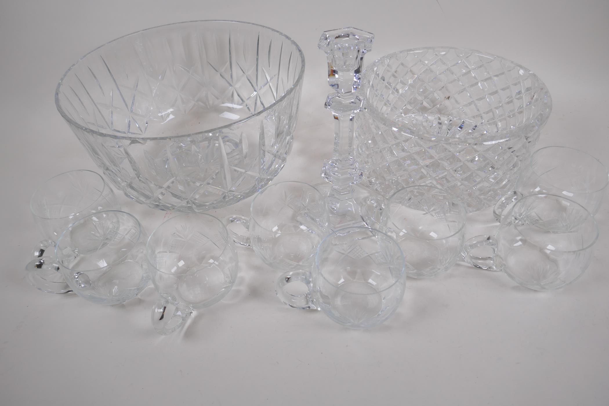 A French Baccarat glass candlestick, 20cm high, a cylindrical crystal bowl, a crystal punch bowl and