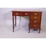 A Victorian mahogany five drawer kneehole desk with leather inset top and brass handles, stamped Jas