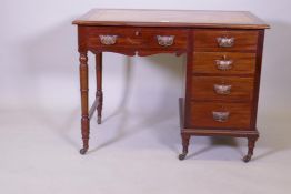 A Victorian mahogany five drawer kneehole desk with leather inset top and brass handles, stamped Jas