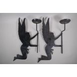 A pair of iron wall sconces in the form of fairies, 25cm x 50cm