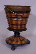 A C19th Dutch fruitwood wine cooler with ebonised decoration and brass liner, 28cm diameter x 44cm