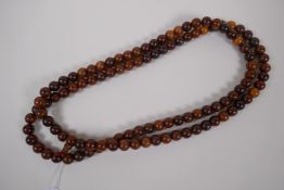 A string of horn prayer beads, 150cm long