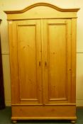 A continental pine knockdown two door pine armoire, 120cm x 60cm x 200cm