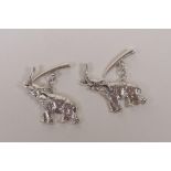 A pair of sterling silver cufflinks in the form of elephants