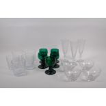 A quantity of C19th drinking glasses including three cut glass champagne flutes, five emerald