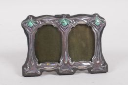 An Art Nouveau style sterling silver double photograph frame with enamelled panels, 11cm x 8cm