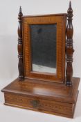 A small antique marquetry inlaid swing toilet mirror on single drawer base, 42cm high x 31cm wide