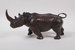 A filled bronze of a rhinoceros, 24cm long