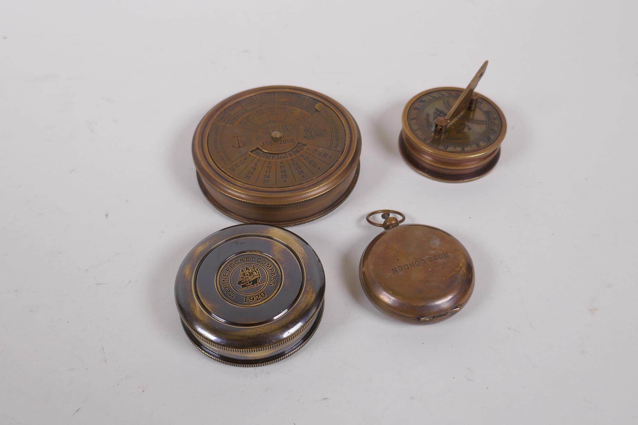 Four assorted reproduction brass compasses, largest 8cm diameter