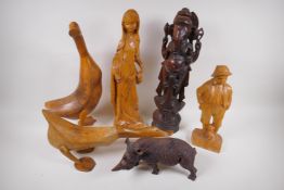 A carved wood figure of a rhinoceros, 26cm long, AF, two carved wood ducks, male and female