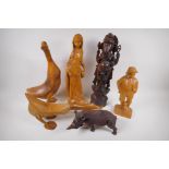 A carved wood figure of a rhinoceros, 26cm long, AF, two carved wood ducks, male and female