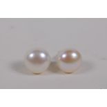 A pair of pearl stud earrings on 925 silver posts