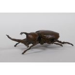 A Japanese Jizai style bronze okimono in the form of a Japanese rhinoceros beetle, 10cm long