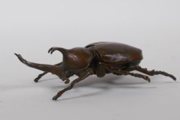 A Japanese Jizai style bronze okimono in the form of a Japanese rhinoceros beetle, 10cm long