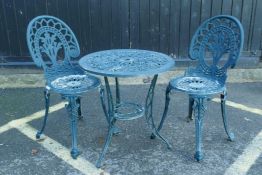 A painted metal garden table and two chairs, 60cm diameter