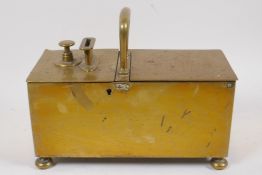 A C19th brass coin operated safe box, 24cm long