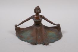 A bronze cartes de visite dish, in the form of a woman with outstretched dress, 15cm wide