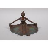 A bronze cartes de visite dish, in the form of a woman with outstretched dress, 15cm wide