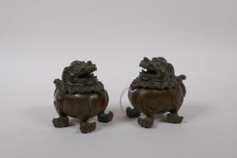 A pair of Chinese bronze censers in the form of fo-dogs, 7cm long, 8cm high