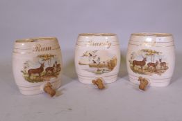 Three ceramic spirit barrels with wood taps, 30cm high