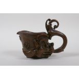 A Chinese bronze libation cup with dragon head decoration, 8 cm high