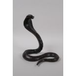 A filled bronze figure of a cobra, 18cm high