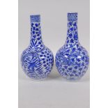 A pair of Chinese blue and white bottle vases decorated with dragons amongst foliage, KangXi 4