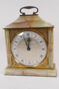 A contemporary onyx and brass cased mantel clock with silvered dial and Roman numerals, 24cm high