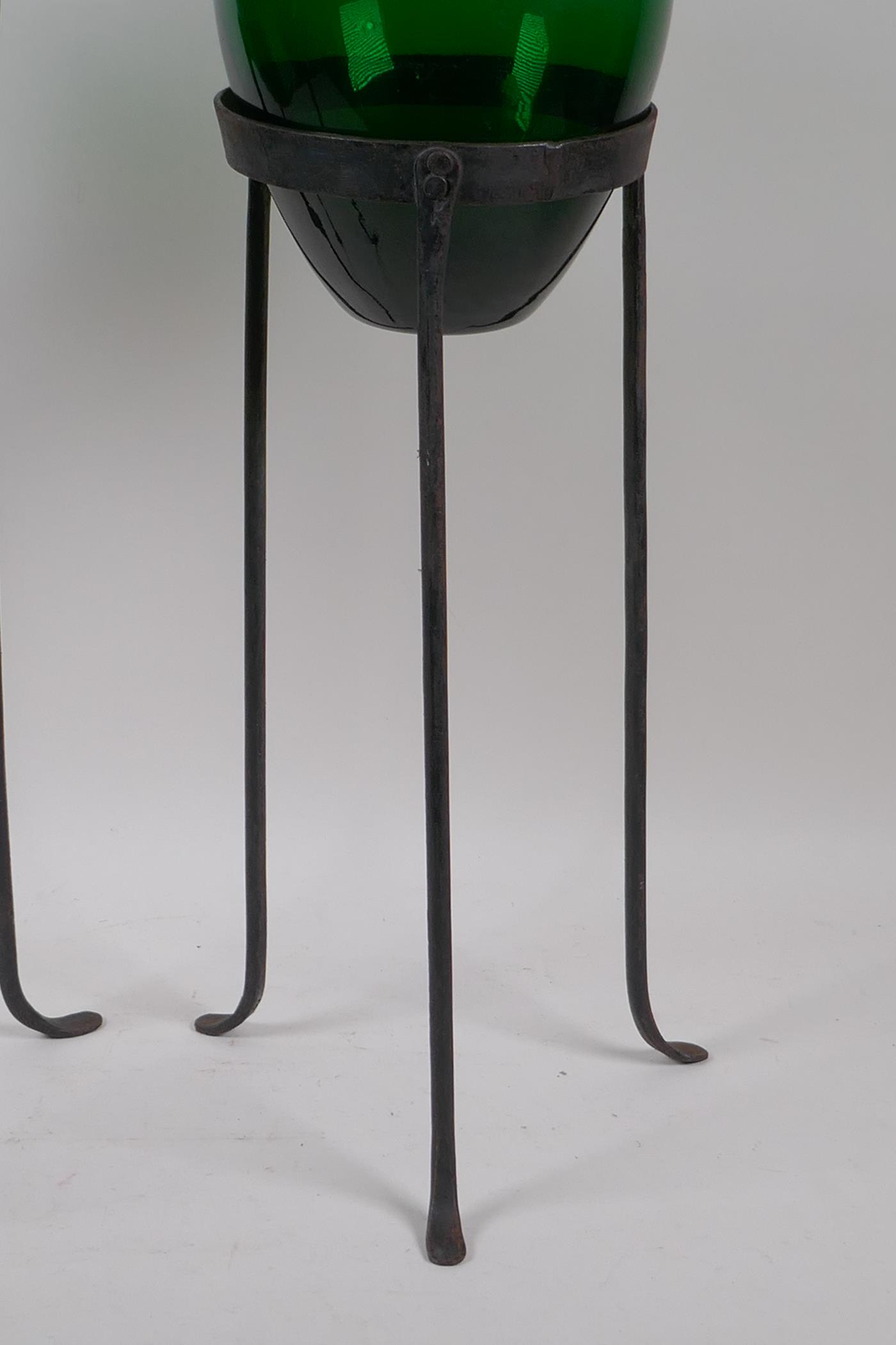 A pair of green glass vases on wrought iron stands, 56cm high - Image 3 of 4