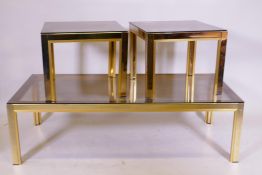 A suite of three brass and smoked glass coffee tables by Zivee, longest 38cm x 130cm x 60cm