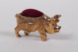 A miniature copper pig pin cushion, 4 cm long