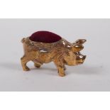 A miniature copper pig pin cushion, 4 cm long