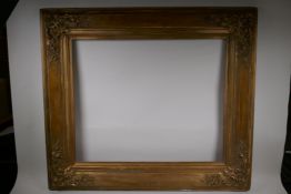 A C19th gilt composition gallery frame, 64cm x 77cm rebate