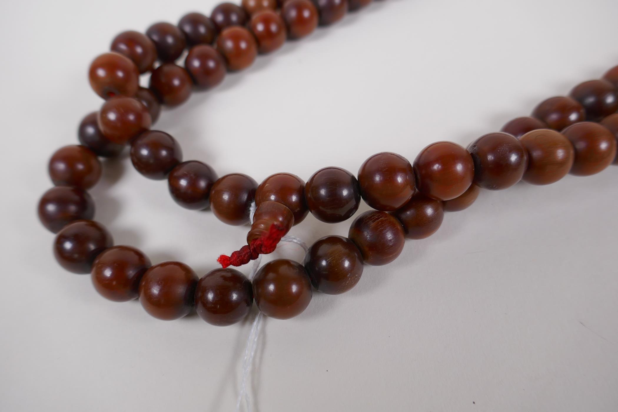 A string of horn prayer beads, 150cm long - Image 2 of 3