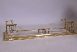 An Edwardian brass fire surround with Adam style decoration, 137cm x 37cm x 24cm